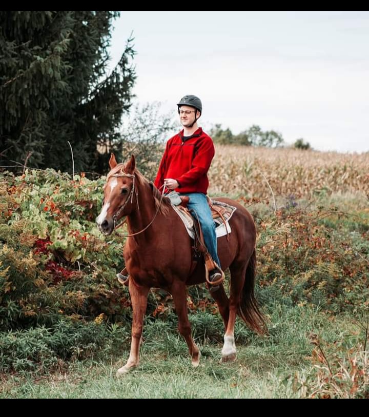 Dan riding Danny on a trail ride